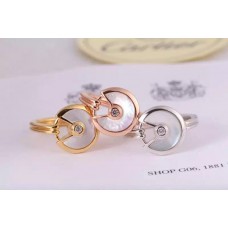 Bague Amulette de Cartier en nacre blanche avec diamant en or jaune Or blanc et or rose