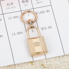 Bague/boucle d'écharpe Hermes Lock en or rose