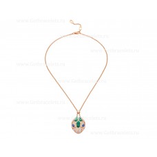 Collier Bvlgari Serpenti en or rose 18 carats avec yeux en saphir bleu, éléments en malachite et pavé de diamants sur le pendentif
